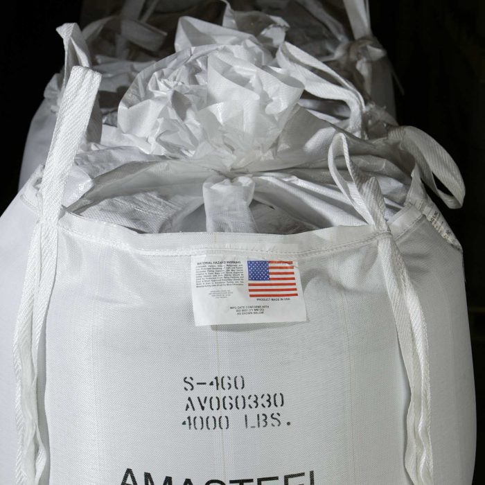 large white bags with "Amasteel - Ervin Industries" written on them